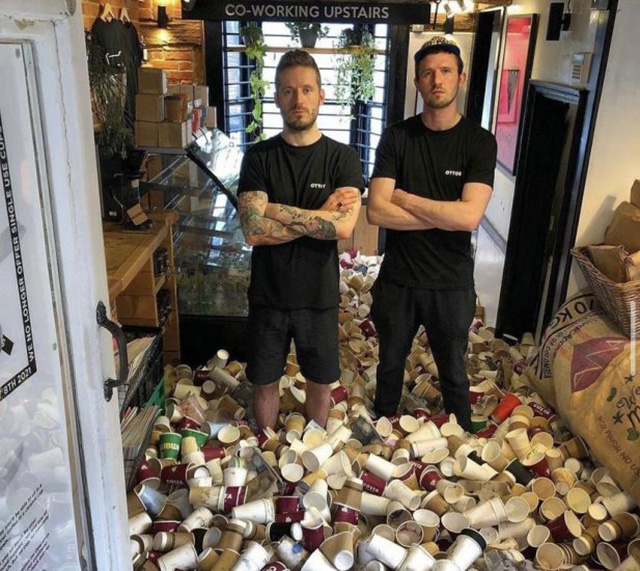 Baristas Standing In Coffee Cup Waste